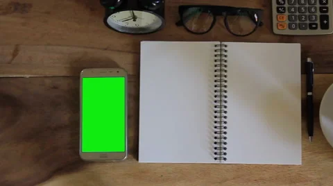 Workspace with notebook, coffee cup and alarm clock in home Video stock 63214113