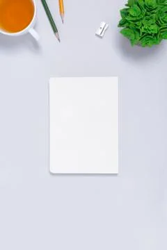 Workspace with notepad on light gray backgroud Stock Photos