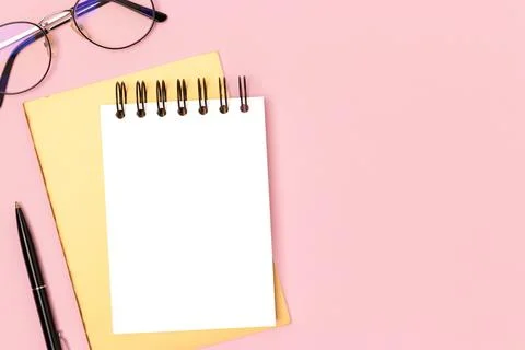 Workspace with notepad mockup and stationery. Stock Photos