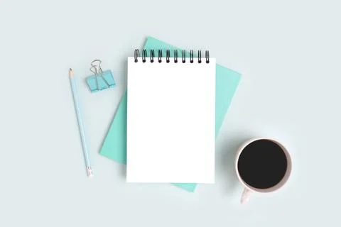 Workspace with open notepad mockup, stationery and coffee cup Stock Photos