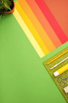 Workspace for paper crafts. Colored sheets, cutting mat, pencil, knife, erase 스톡 사진