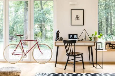 Workspace with red bicycle Stock Photos