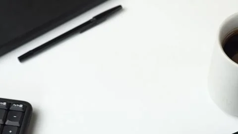 Workspace table with coffee, note, pen and keyboard display Stock Footage 262434998