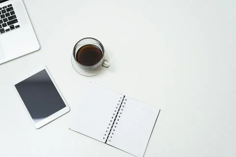 Workspace with tablet, note and cup of coffee Stock Photos