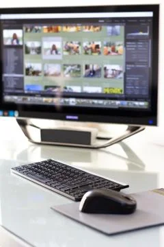 Workstation consisting of computer, keyboard, mouse, and monitor Stock Photos