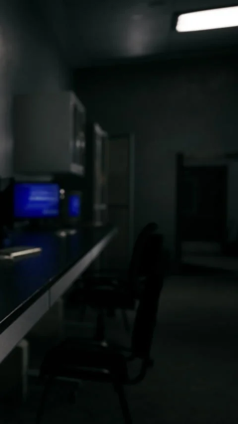 Workstation in an office during the evening with dim light and empty chairs Stock Footage 337951767