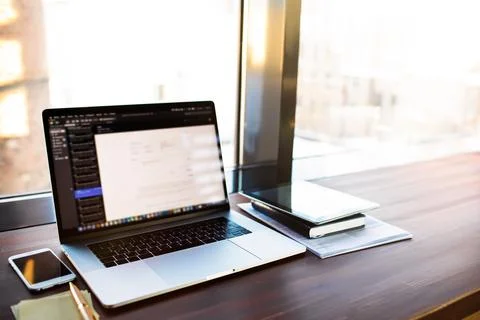 Workstation with open pc laptop computer with blurred web programs on the scr Stock Photos