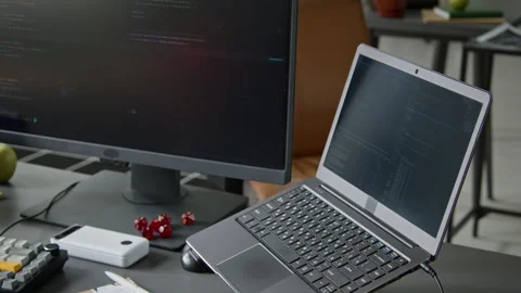 Workstation of Software Developer with Laptop and Desktop Computer Stock Footage 335937114