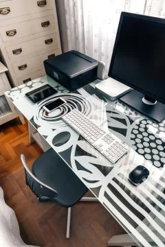 Workstation with table, chair, computer and printer Stock Photos