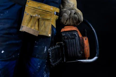Workwear for production workers. A construction worker holding protective acc Stock Photos