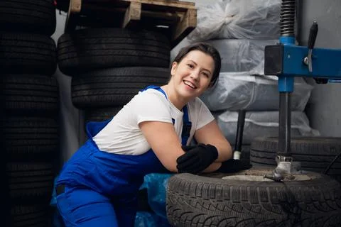 Workwoman posing while working on the press Stock Photos