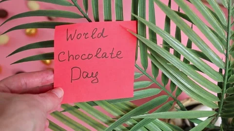 World Chocolate Day note in woman's hand. Stock Footage 303869807