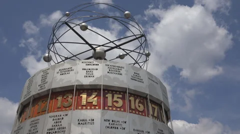 World clock slow rotation motion Berlin city landmark sunny day display hour sky Stock Footage 40492165