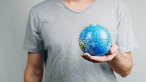 World Environment Day. Garbage gallows is killing the world. Male hand holds  Stock-Footage 121583908