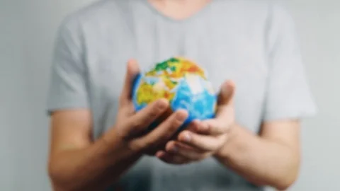 World Environment Day.  Global warming and plastic emissions. Male hand holds 스톡 동영상 121583886