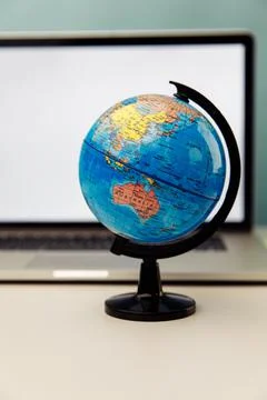 World globe with laptop background. Vertical image Stock Photos