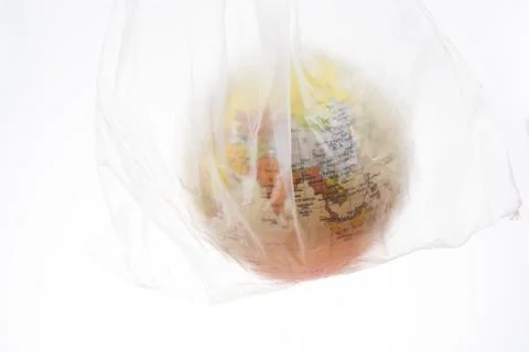 World globe in plastic bag isolated on white background Stock Photos