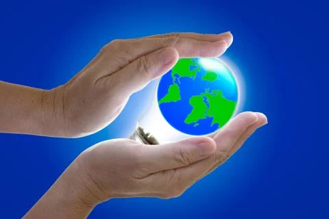 The world in light bulb on the hand Stock Photos