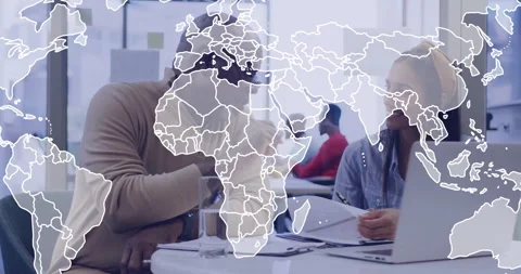 World map animation over diverse colleagues discussing work at office desk Stock Footage 305031461