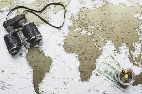 World map background money binoculars Stock Photos
