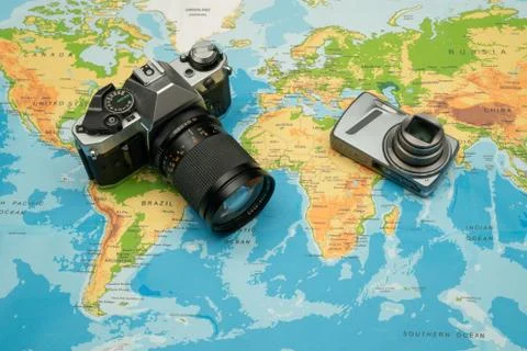 World map, camera. Travel concept Stock Photos