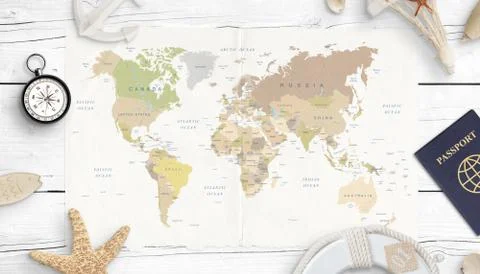 World map, compass, passport and shells. Concept of travel planning. Top view Stock Photos