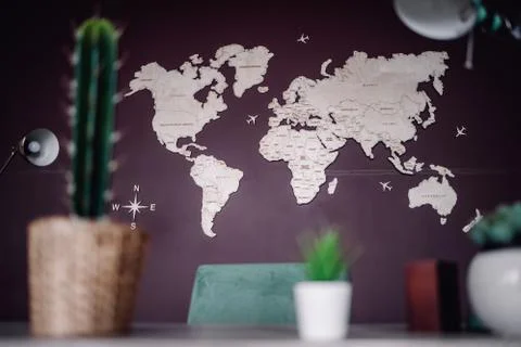 World map designed on wall of office with defocused table accessory Stock Photos