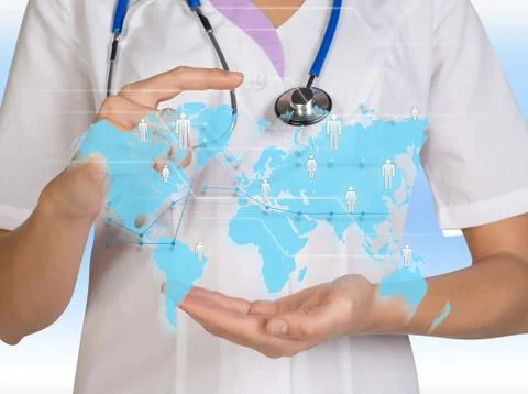 World map. The doctor presses a computer interface 스톡 사진