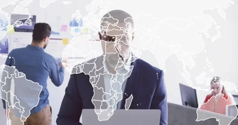 World-map fading in, manager holding laptop watching, colleagues planning, Stock Footage 334111839