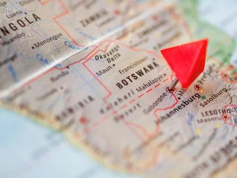 World map with focus on Republic of Botswana with red triangle pin on capital 库存照片