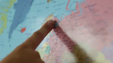 World map hanging on the wall, Finger shows countries Vídeos de archivo 119022744