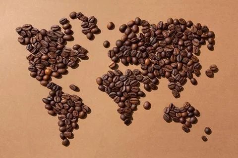 World map made with coffee beans on brown background Foto stock