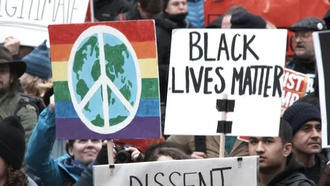 World Peace And Black Lives Matter Signs At Rally Stock Footage