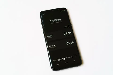 World time on mobile phone screen Stock Photos
