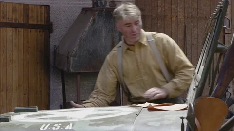 World War 2 – Germans preparing caputed US Jeep for changing the paint Stock Footage