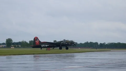 World War II era B-17 Flying Fortress taxis in to park Stock Footage 111869288