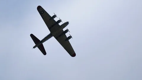 World War II era B-17 Flying Fortress does a flyover Stock Footage