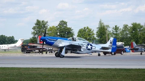 World War II era P-51 Mustang taxis by at airshow Stock Footage 114437836