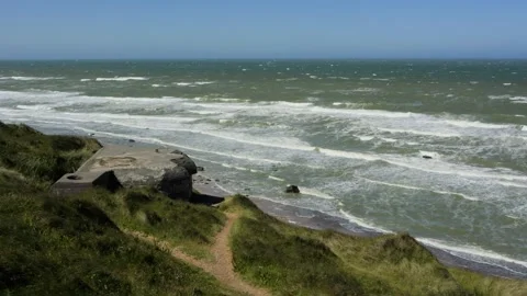 World war ii german bunker overlooking the rough sea Stock Footage 338329098