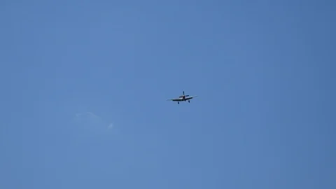 World War II P-51 Mustang flies overhead for a landing Stock Footage 114410464