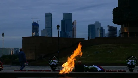 World war memorial fire burning in front of Moscow International Business Center Stock Footage 99607073