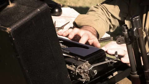 World War Two - Communications officer typing on typewriter at army base V2 Stock Footage 79080707
