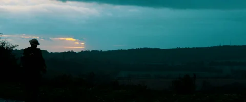 World War Two Soldier Walking Across French Land During War Stock Footage 169752872