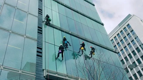 World's Bravest Window Cleaners dangle from a skyscraper Stock-Footage 79074327