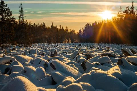 The world's largest stone river in the snow in the rays of the setting sun Stock Photos