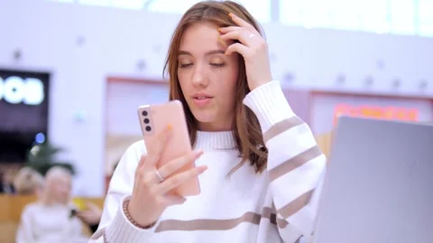 Worldwide work Female developer working on laptop sitting cafe in mall. Woman 動画素材 270258675