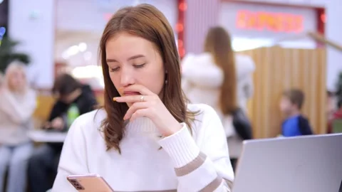 Worldwide work Female developer working on laptop sitting cafe in mall. Woman Stock Footage 270313960