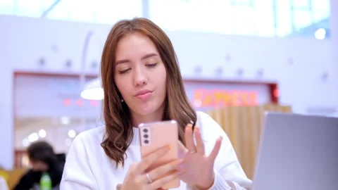 Worldwide work Female developer working on laptop sitting cafe in mall. Woman Stock Footage 270540567