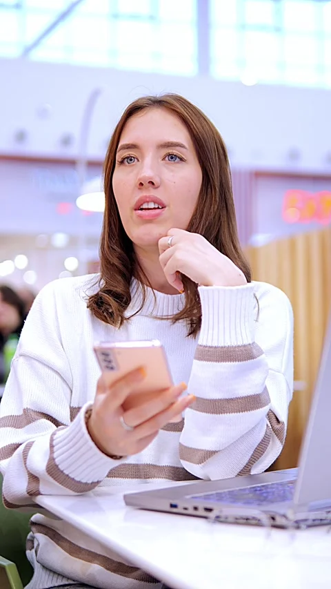 Worldwide work Female developer working on laptop sitting cafe in mall. Woman Stock Footage 274518018