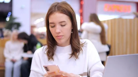 Worldwide work Female developer working on laptop sitting cafe in mall. Woman 스톡 동영상 274797795